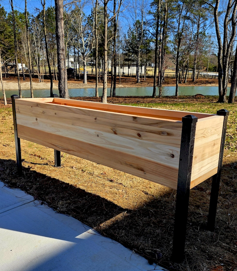 Premium cedar planter box installed outdoors in a backyard garden